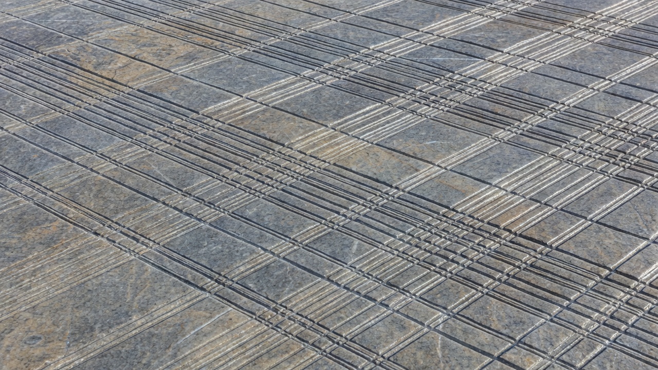 Fine parallel striations running across polished Norwegian bedrock
